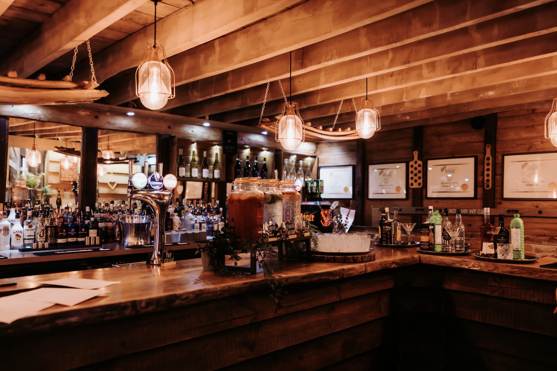 The rustic bar in the barn, stools along the counter