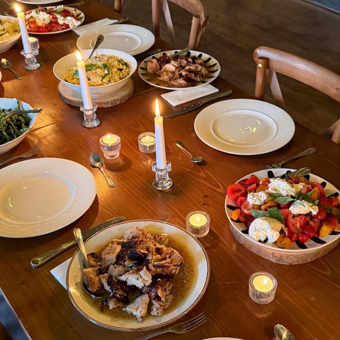 Shared dishes and candles along the table at the Granola Girls retreat