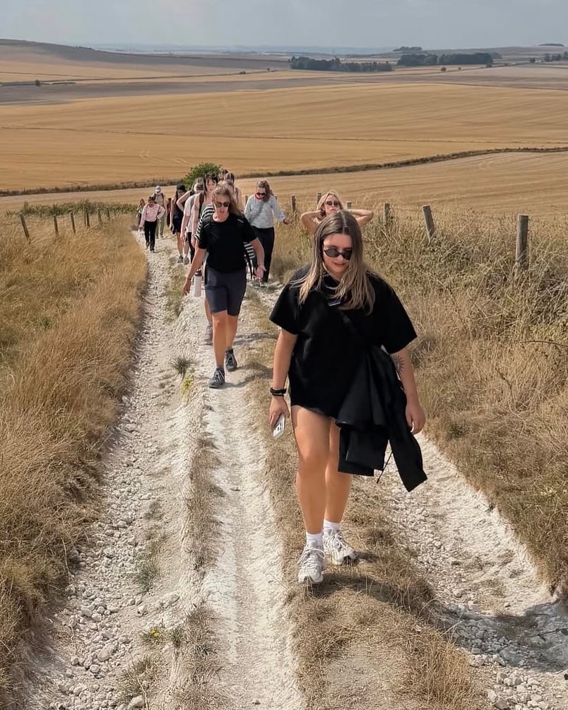 The retreat group walking a chalk track between harvested fields